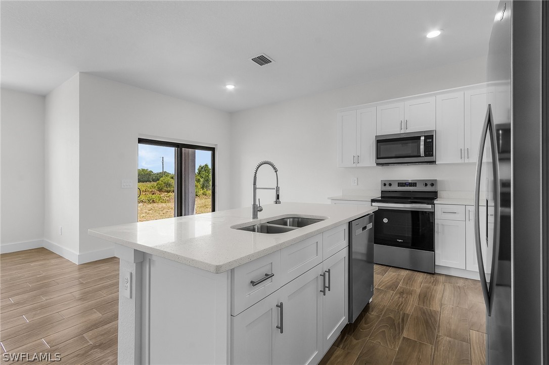 Bamboo Model kitchen with quartz countertops and stainless appliances