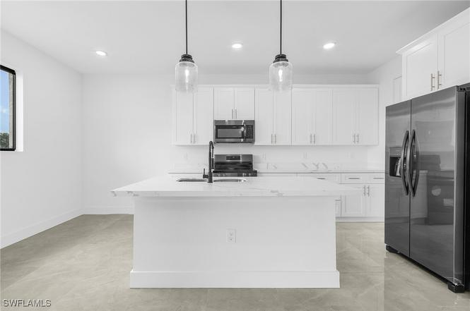 Oasis Model kitchen angle view 1 — custom cabinetry