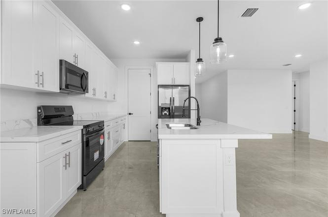 Oasis Model kitchen angle view 2 — quartz countertops