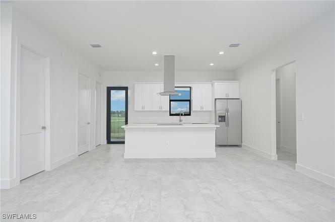 Justice Model kitchen view 1 — custom cabinetry and countertops
